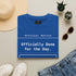 Funny Work T-Shirt - Officially Done for the Day tee worn by a woman sitting on a couch.